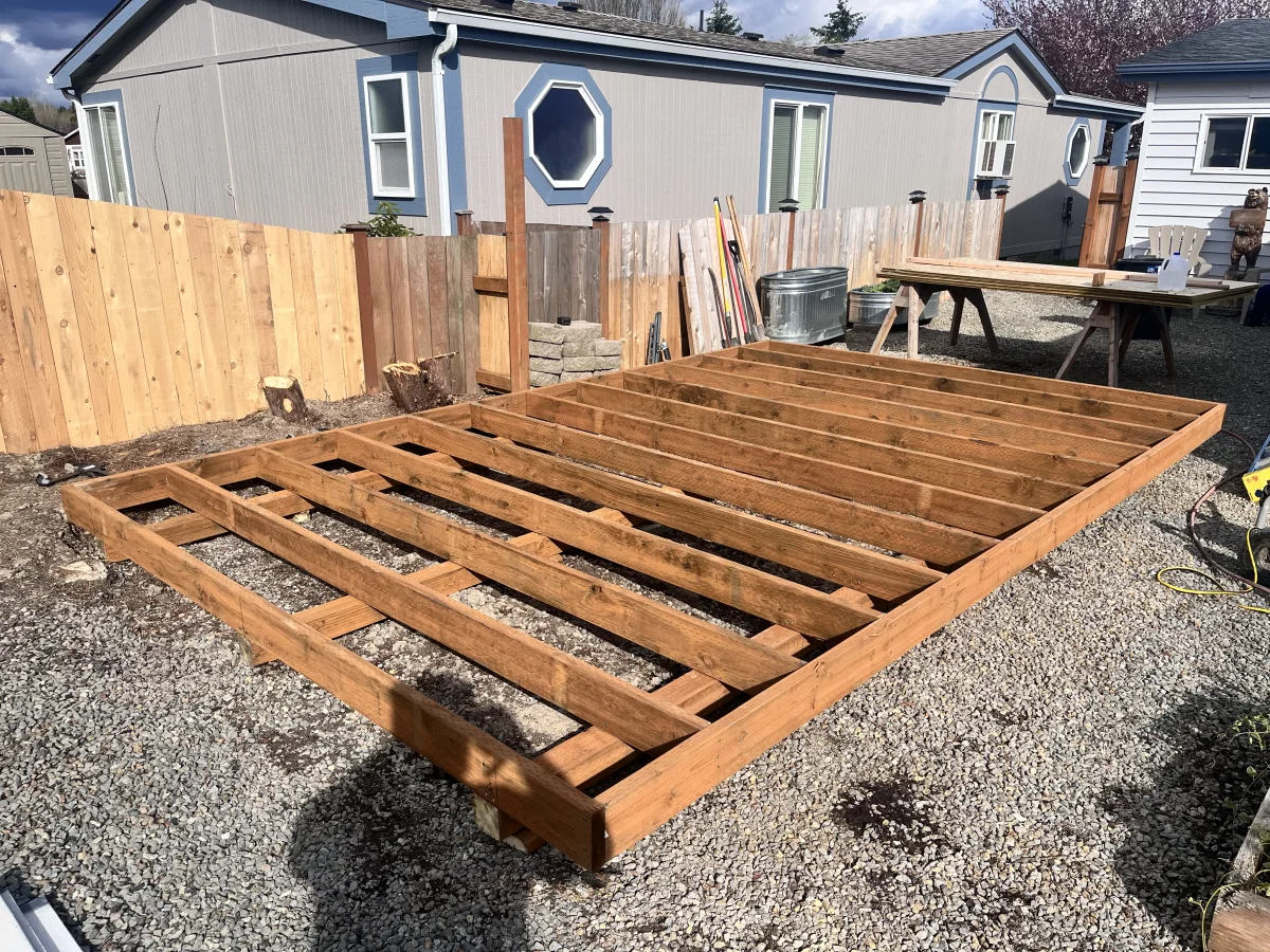 Pressure treated floor joists being installed on-site