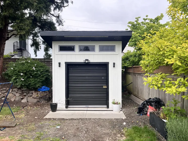 Man cave shed with roll-up garage door